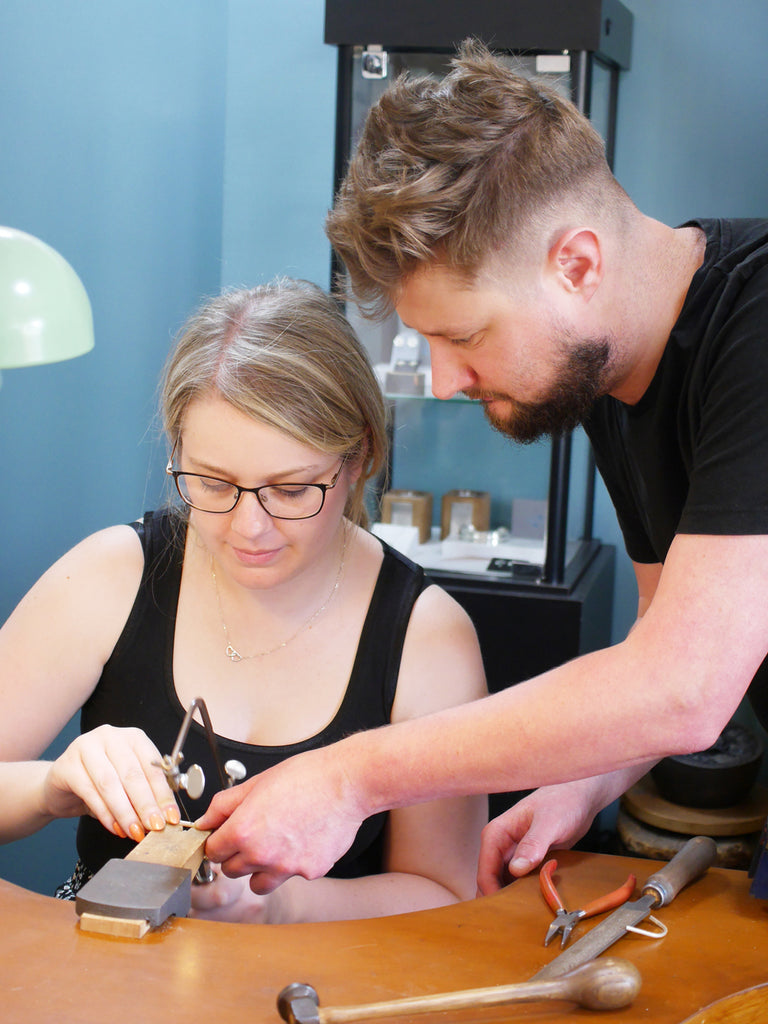 Katy & Gareth cutting the gold to size.