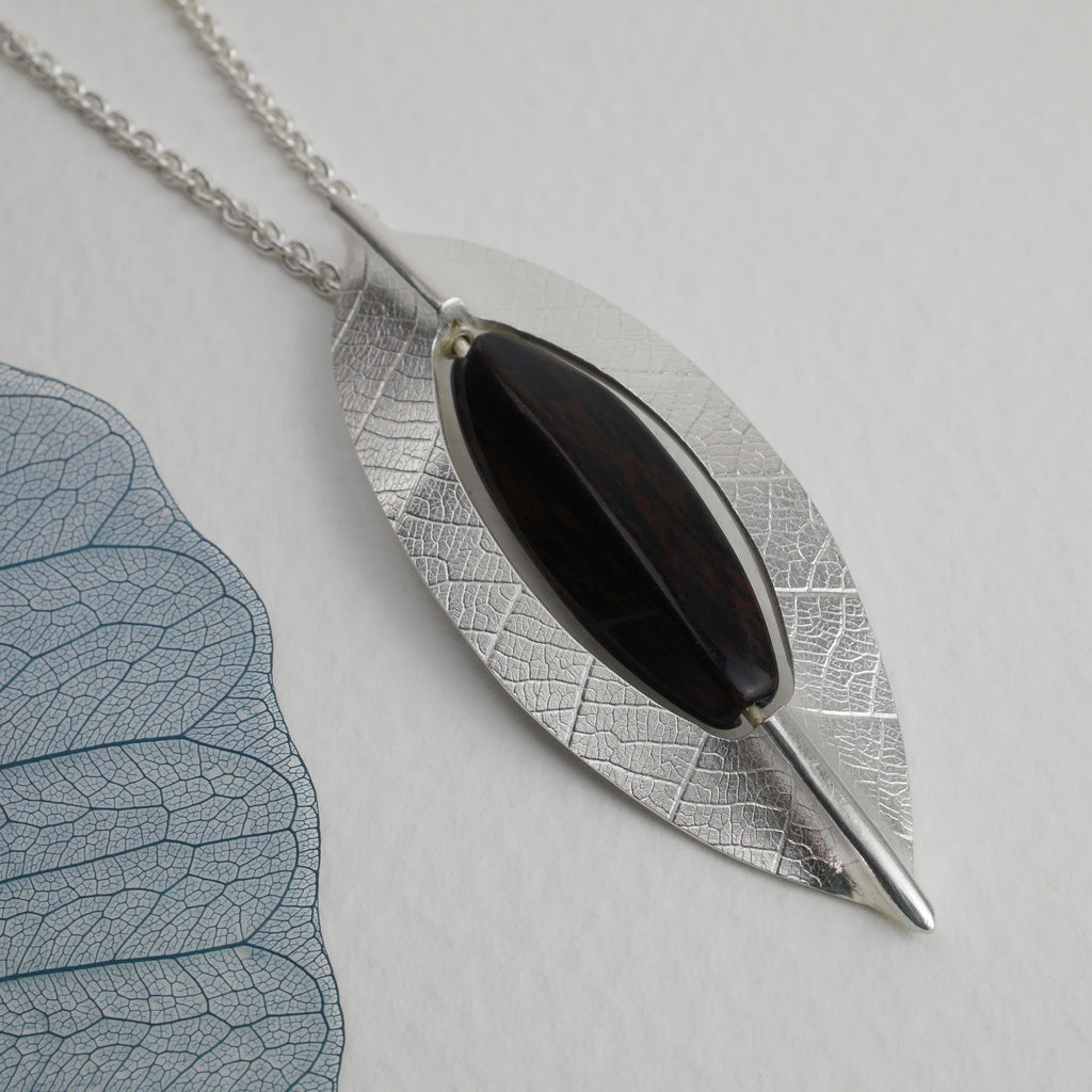 Close up of the new leaf pendant featuring the black obsidian bead which rotates, adding a lovely tactile element to this necklace