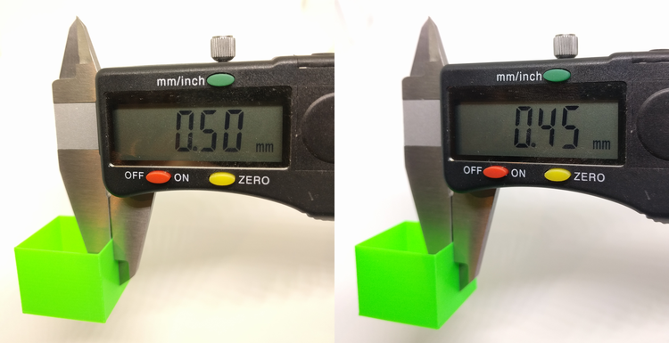 Digital calipers comparing wall thickness of two prints