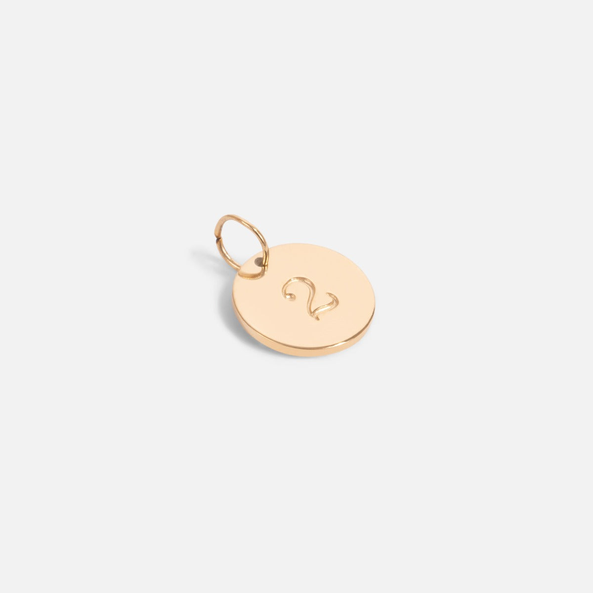 Small golden charm engraved with the number "2"