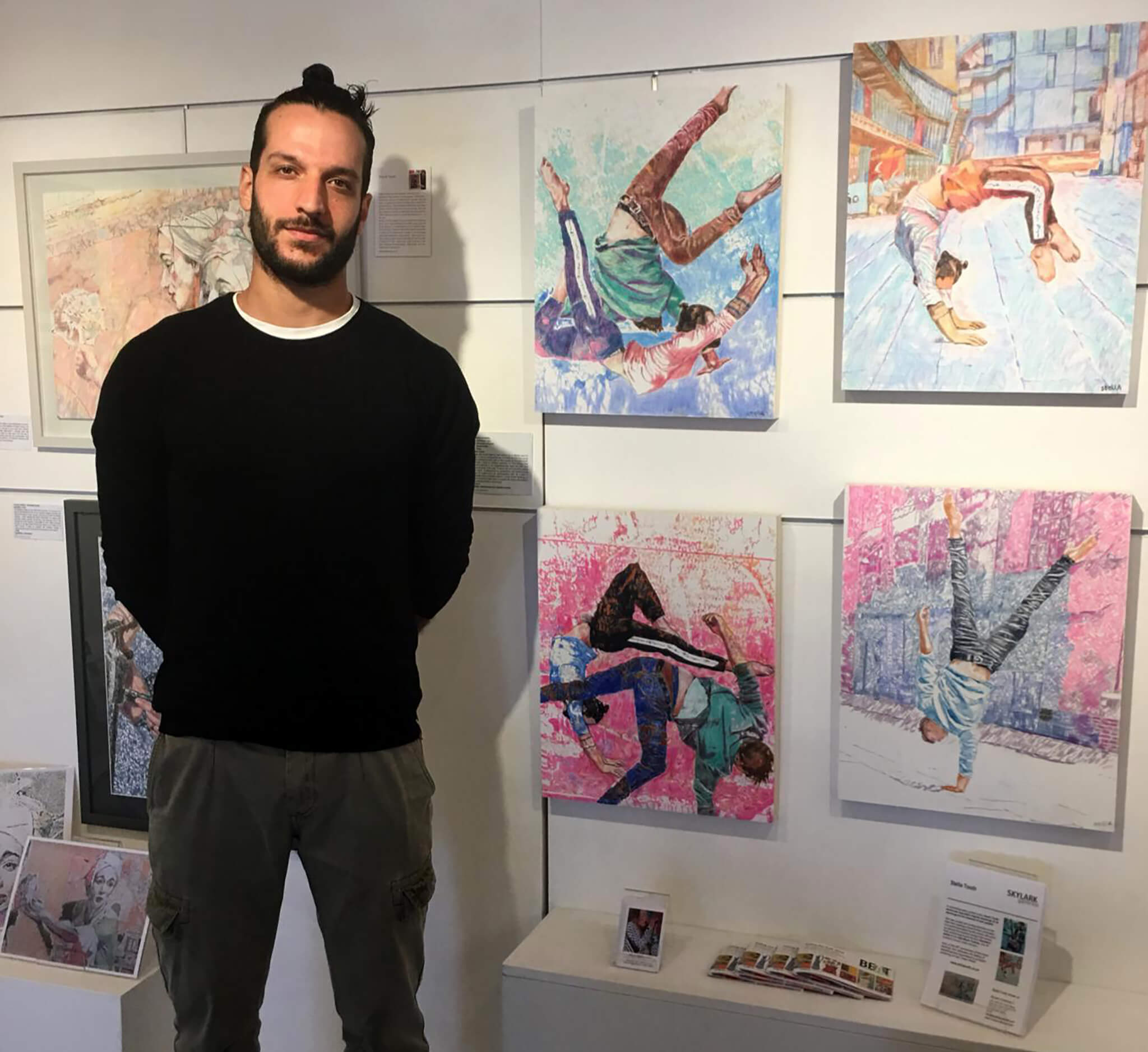 Acrobat Manuele d'Aquino at Skylark Galleries with Stella Tooth's pencil on cradled gesso panel portrait of him.