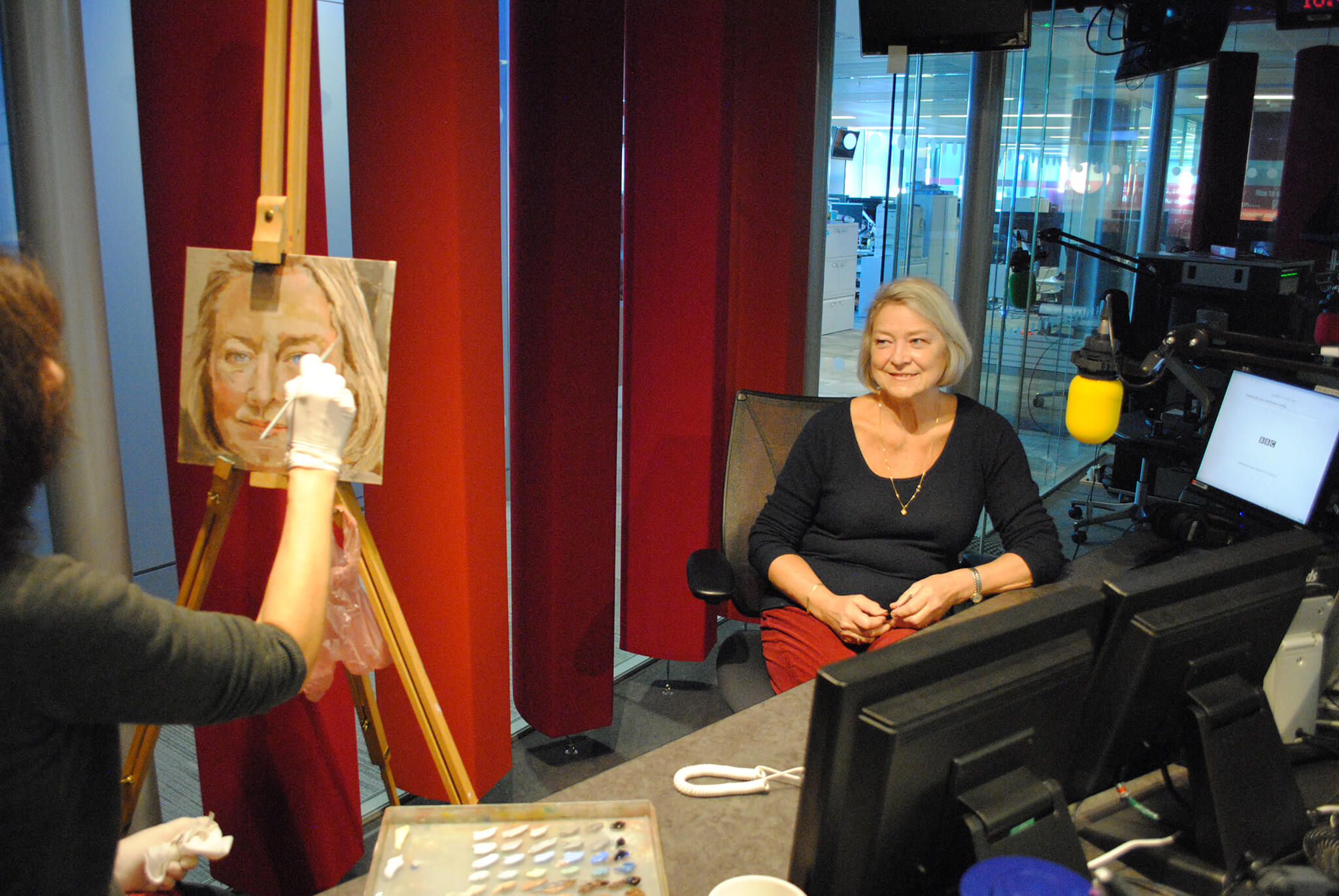 Artist Stella Tooth painting study in oils on canvas board of BBC's Kate Adie.