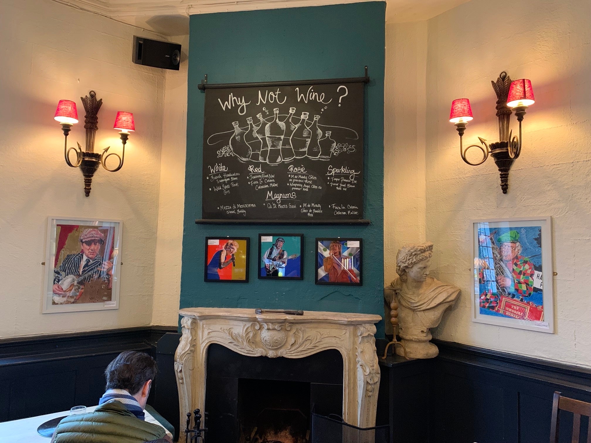 Musician artworks by Stella Tooth on the walls of the Half Moon Putney