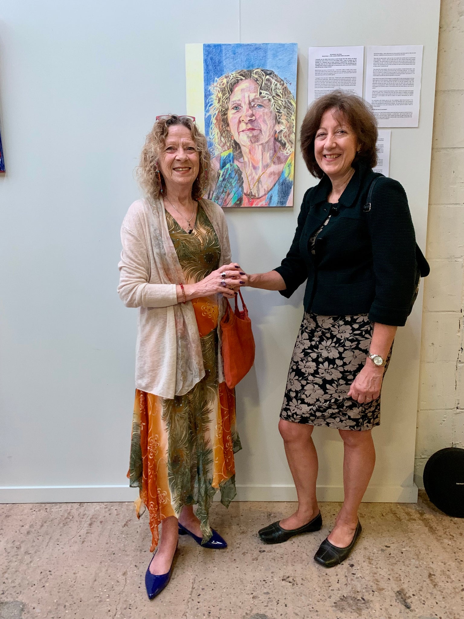 Stella Tooth artist with her portrait of Marie Drewa and sitter