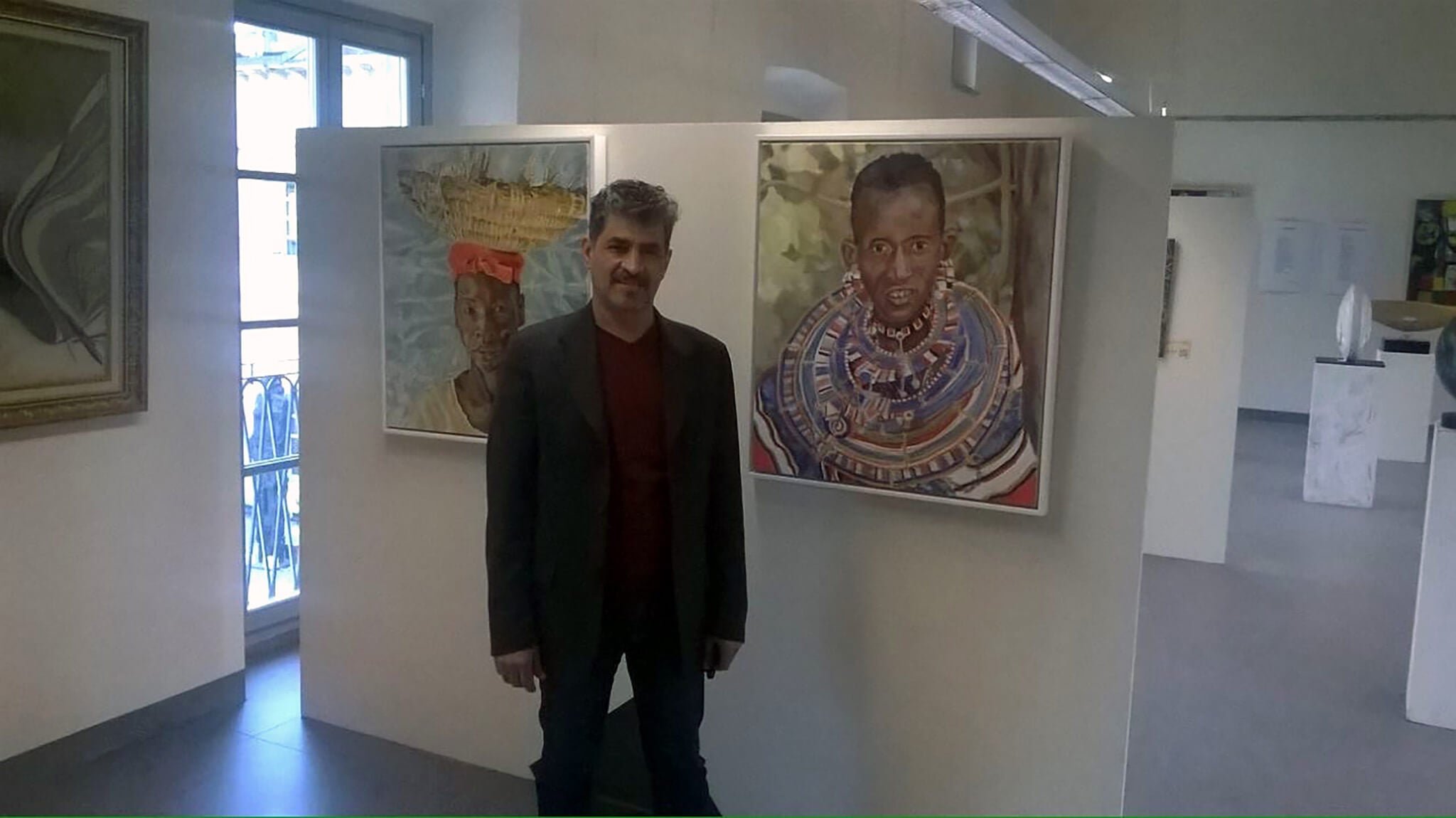 Stella Tooth's oil portraits of The Hod Carrier and Maasai woman at the Milan Expo Arte Senza Confini Soul food with organiser Gamal Meleka.