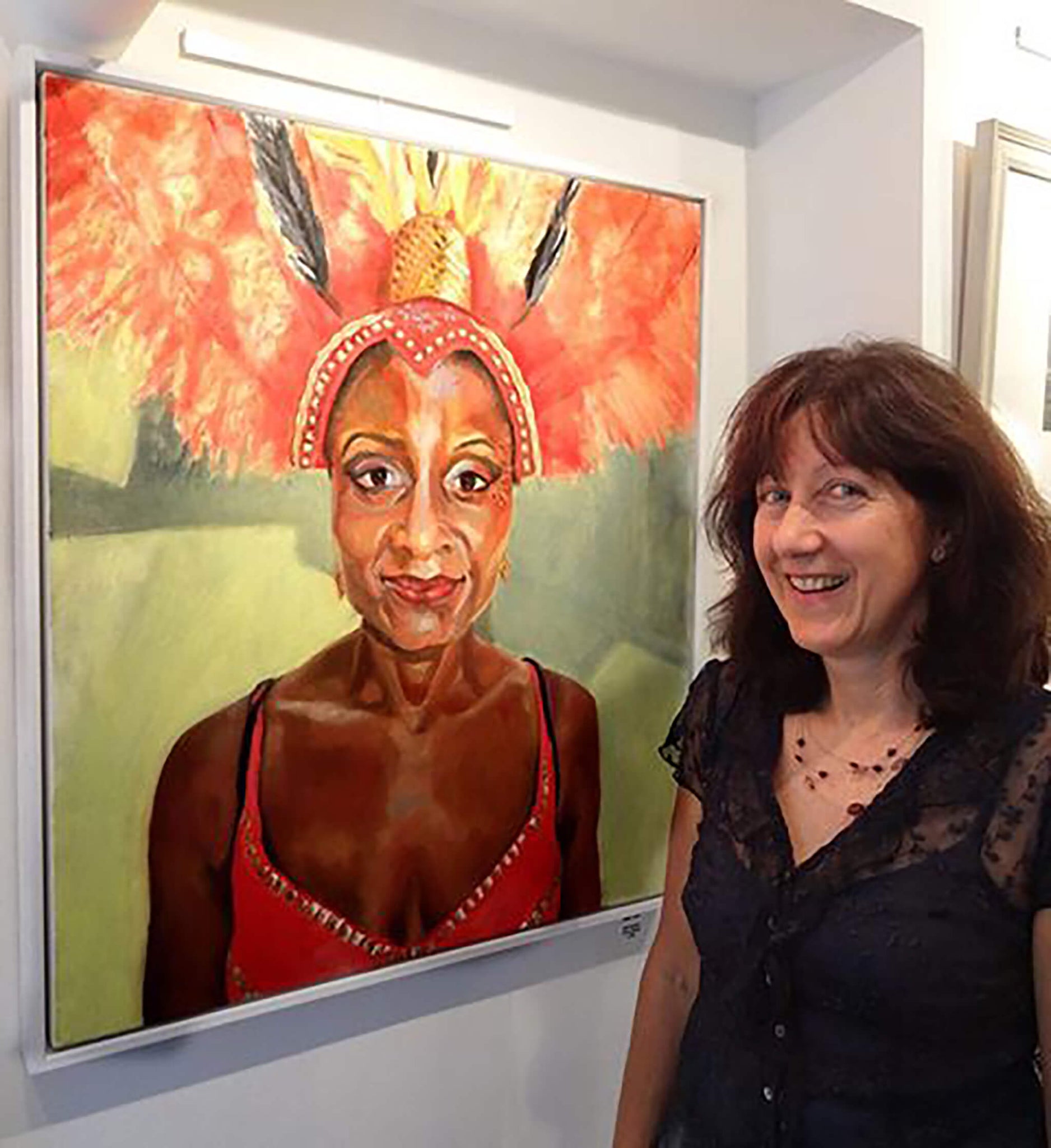 Stella Tooth with her portrait of Jumping up at The Photographer's Gallery Exhibition by David Ingham.