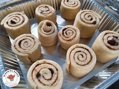 Raw cinnamon rolls in tray