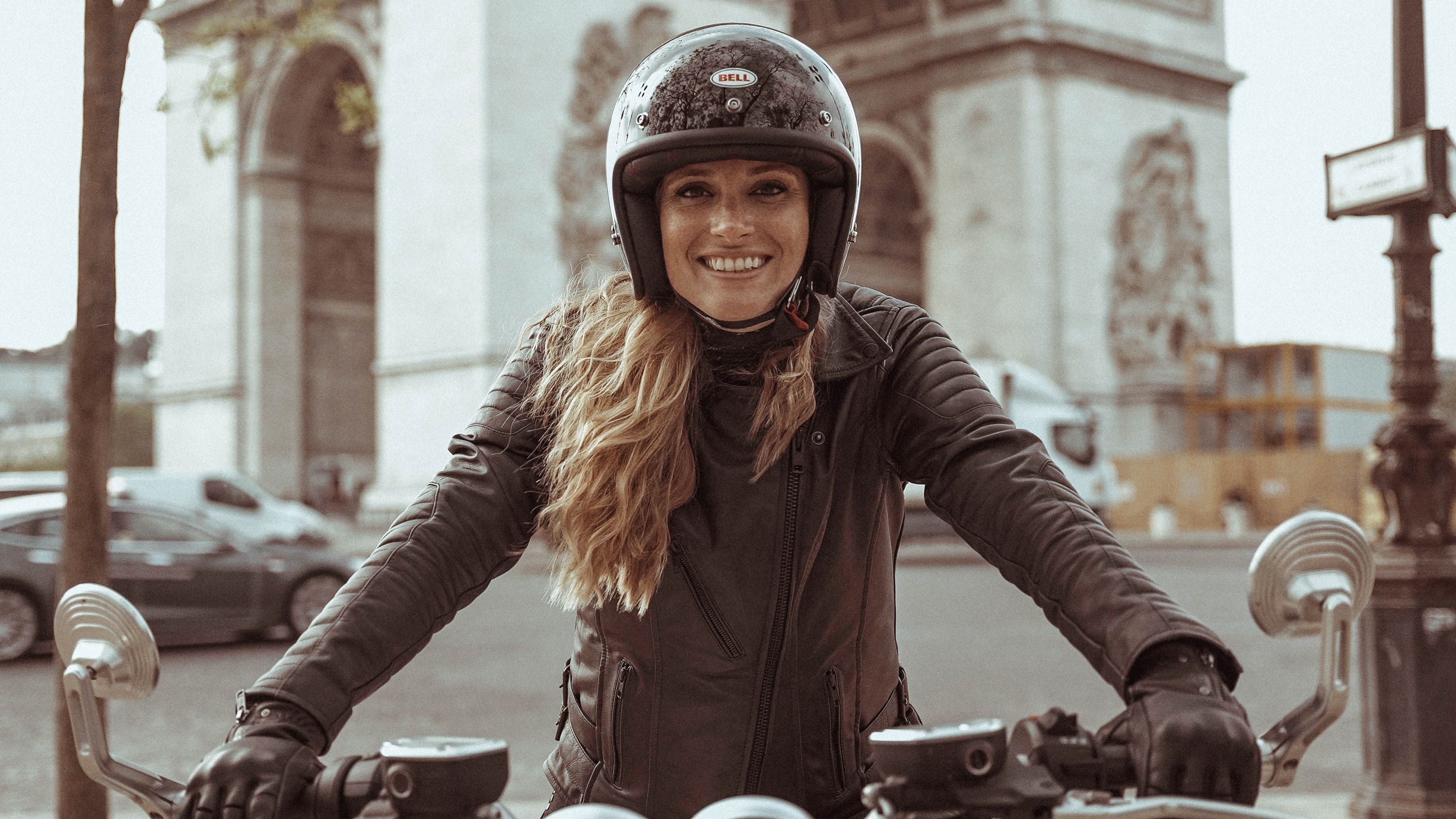 Elie's smilling on the motorcycle