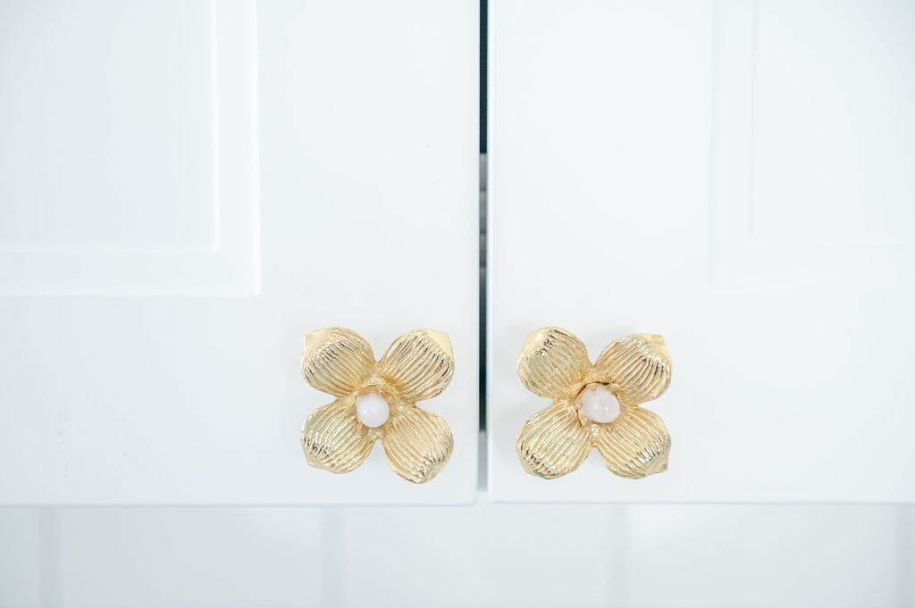 White Kitchen Cabinets with Dogwood Brass Knobs with Rose Quartz