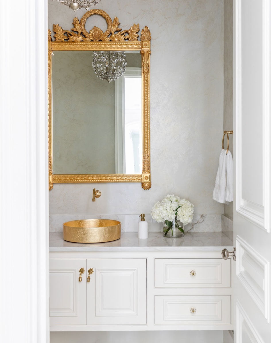 Elegant White Bathroom with Regal Gold Mirror and Mayan Drop Pulls on the Vanity