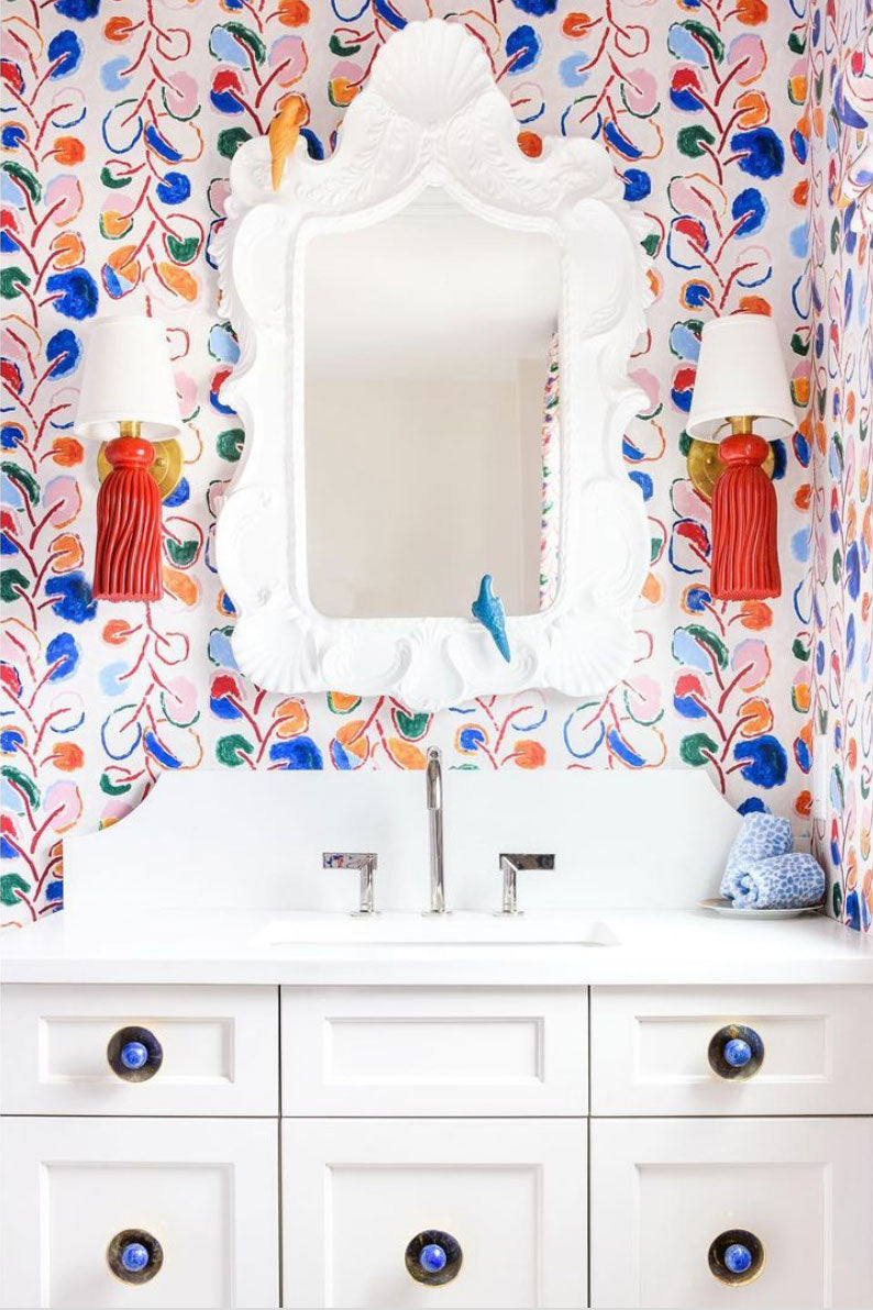 Colorful and Fun Bathroom with White Cabinets Featuring Gibson Knobs in Brass with Lapis Gemstones