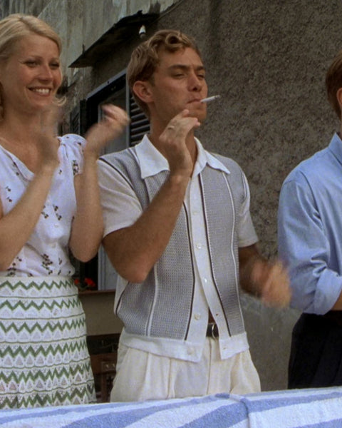 Jude Law wearing a knitted polo as Dickie Greenleaf in The Talented Mr Ripley