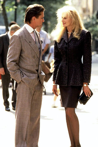 Michael Douglas as Gordon Gekko wearing a grey double breasted suit in the 1987 movie Wall Street