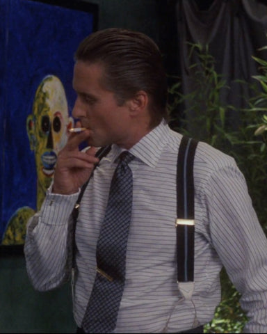 Michael Douglas as Gordon Gekko wearing a horizontal striped shirt in the movie Wall Street