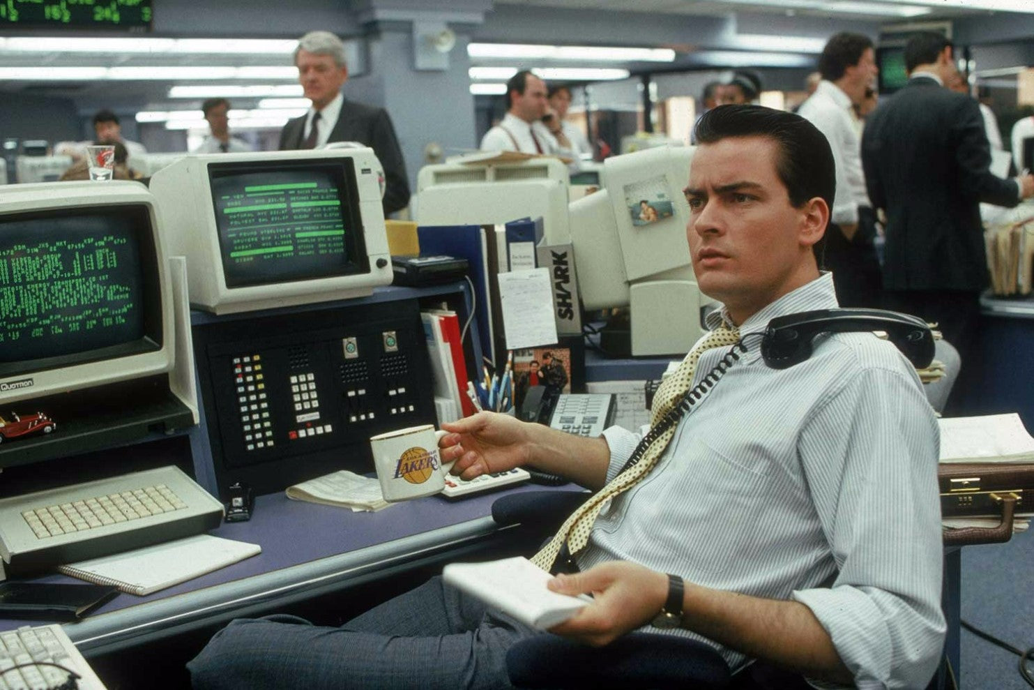 Charlie Sheen as Bud Fox in Wall Street wearing an OCBD with yellow tie