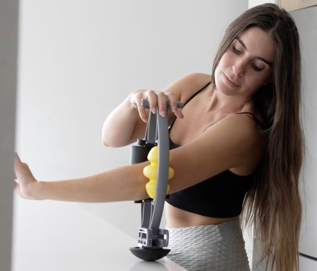 woman using rolflex foam roller to massage arm