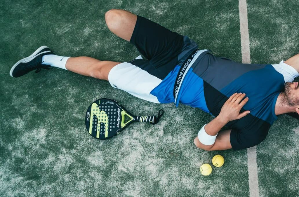 tennis player suffering pulled muscle injury