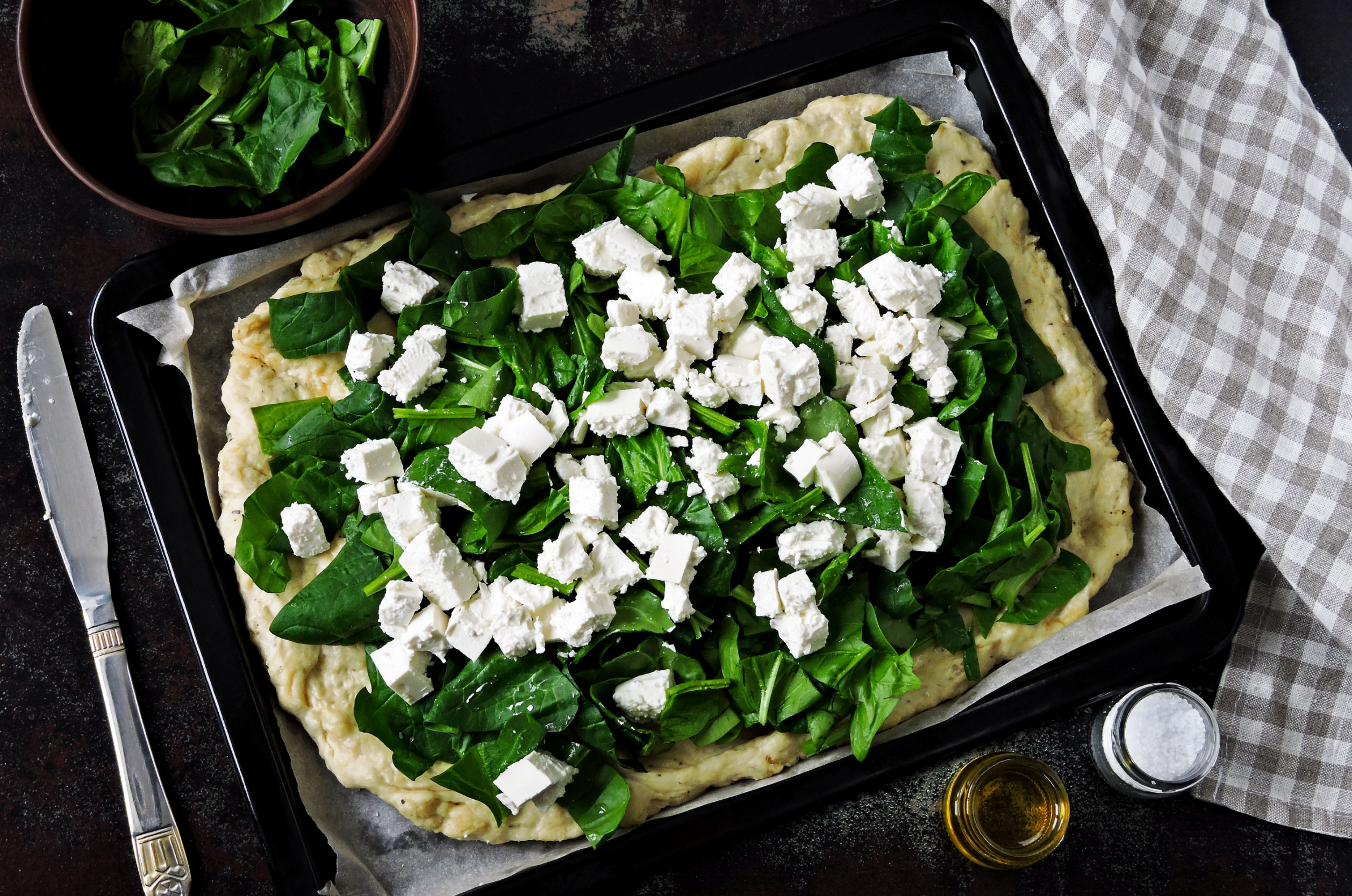 Lots Of Feta Cheese Chunks Topping Fresh Spinach Pizza On Gluten Free Crust