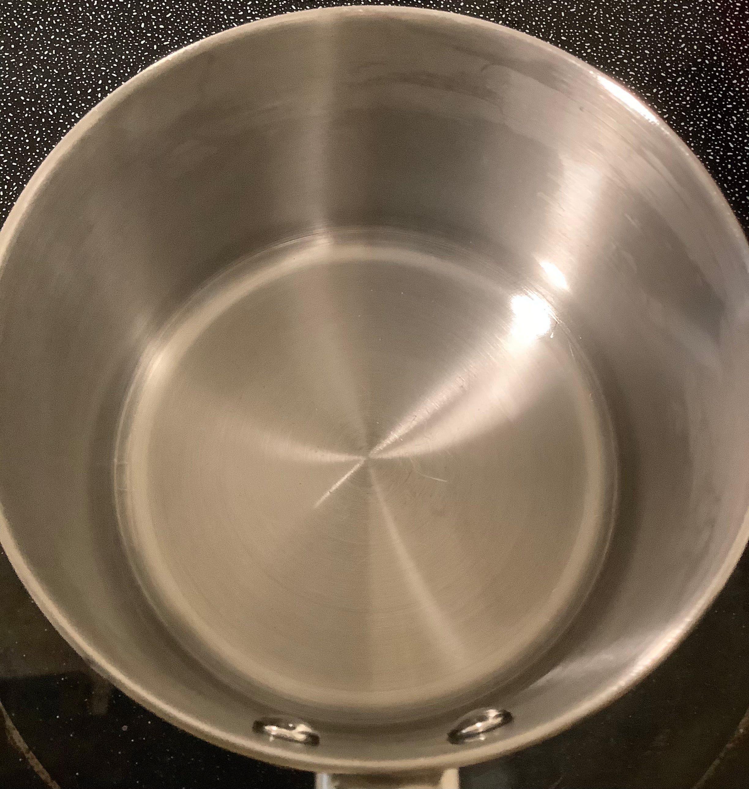 Stainless Steel Cooking Pot With Burnt Scorched Damage After Cleaning