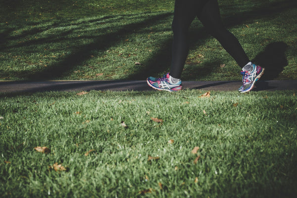 Persons Feet Walking On Path Getting Daily Exercise Outdoors