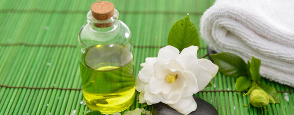 oil bottle with gardenia and towel