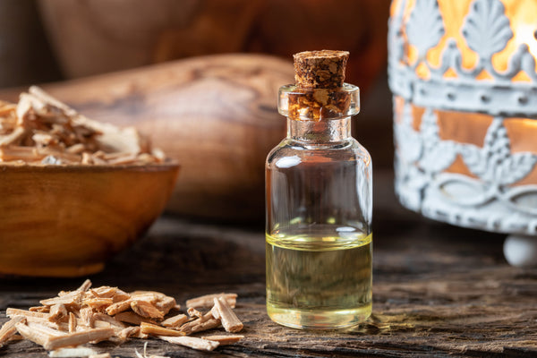 essential oil bottle with cedarwood chips
