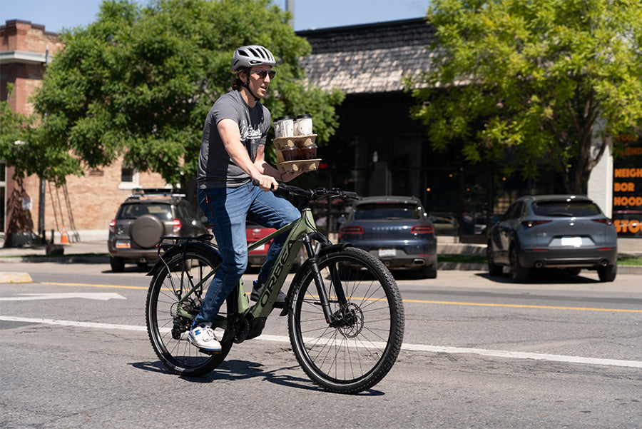 joseph on a coffee run on an orbea bike