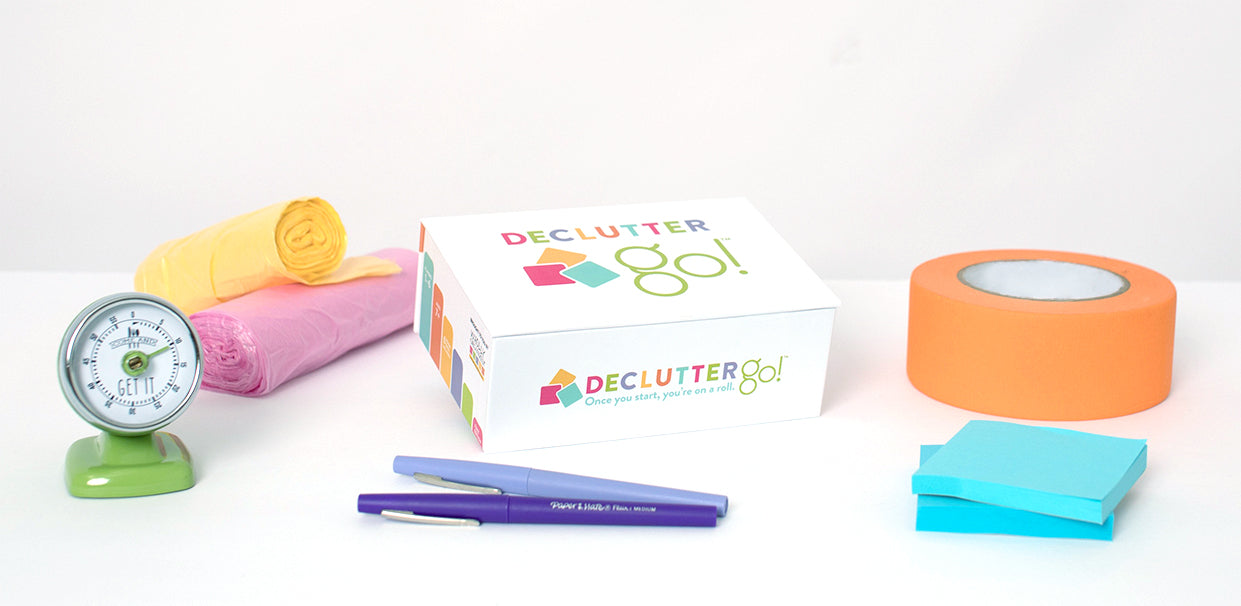 Declutter Go! Game Box, painters tape, sticky notes, pens, timer, trash bags