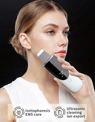 A woman is holding a Smart Blackhead Remover device.
