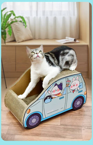 A cat is lounging on top of a cardboard car, designed specifically for feline comfort.