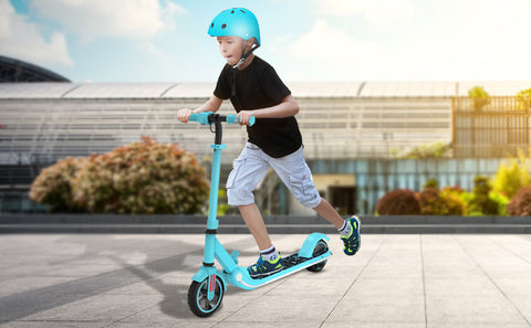 A boy riding a blue scooter, the perfect gift for kids.