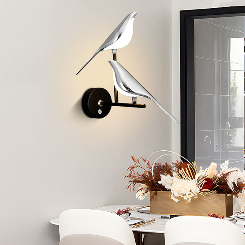 Modern Bird Wall Light sconces illuminating a dining area as an accent piece in the interior design.