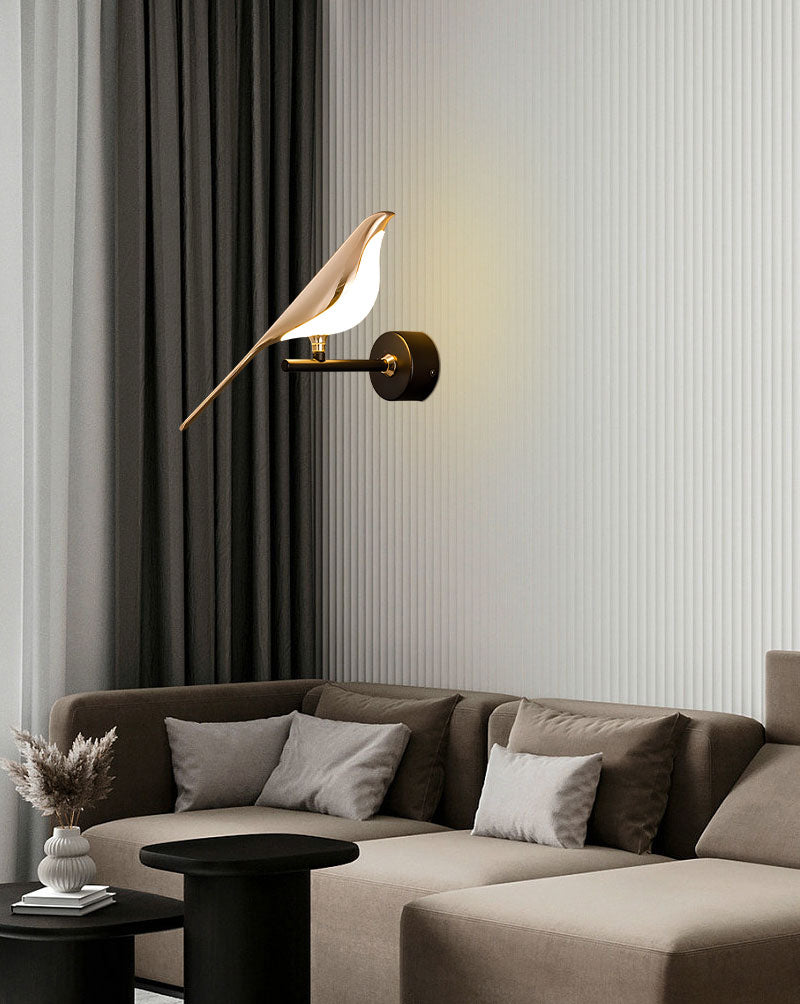 Elegant Bird Wall Light, acting as an accent piece, illuminates a modern living room with a neutral-toned sectional sofa and minimalistic decor.