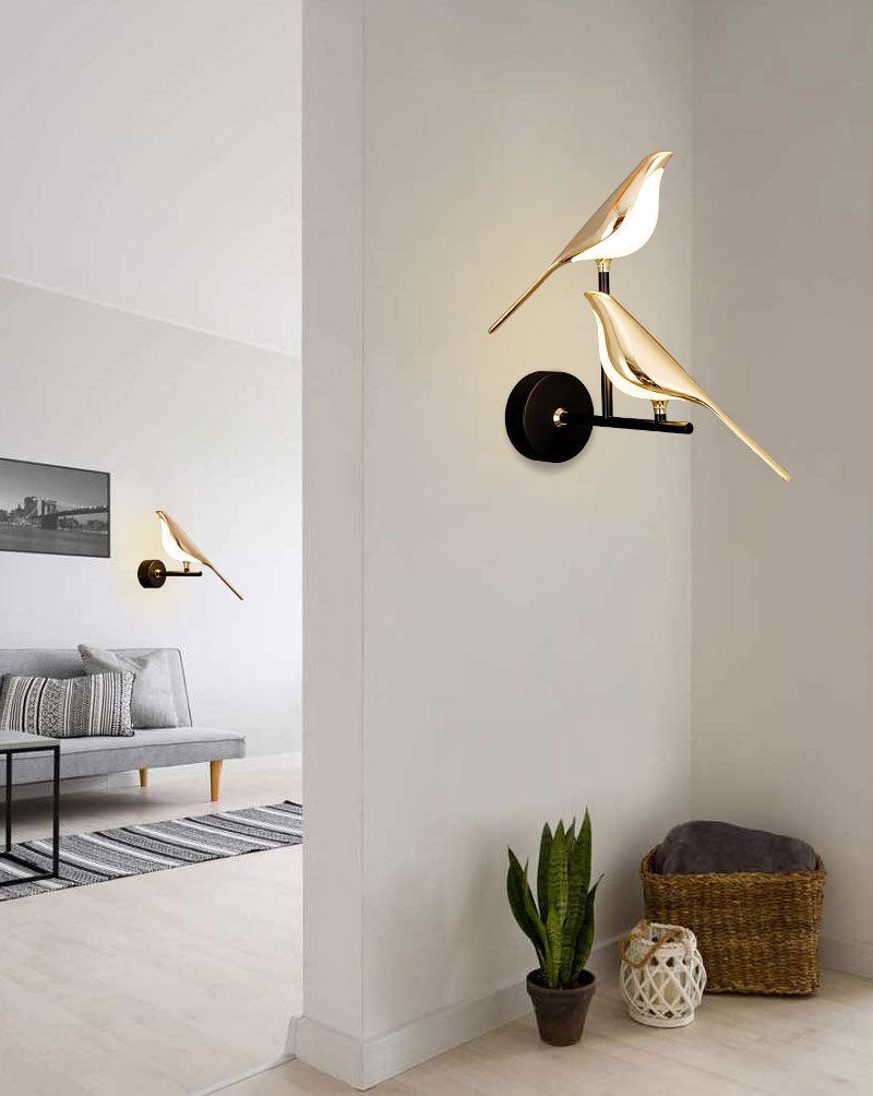Modern Bird Wall Light fixtures serve as an accent piece in a minimalist living room, mounted stylishly on the wall.