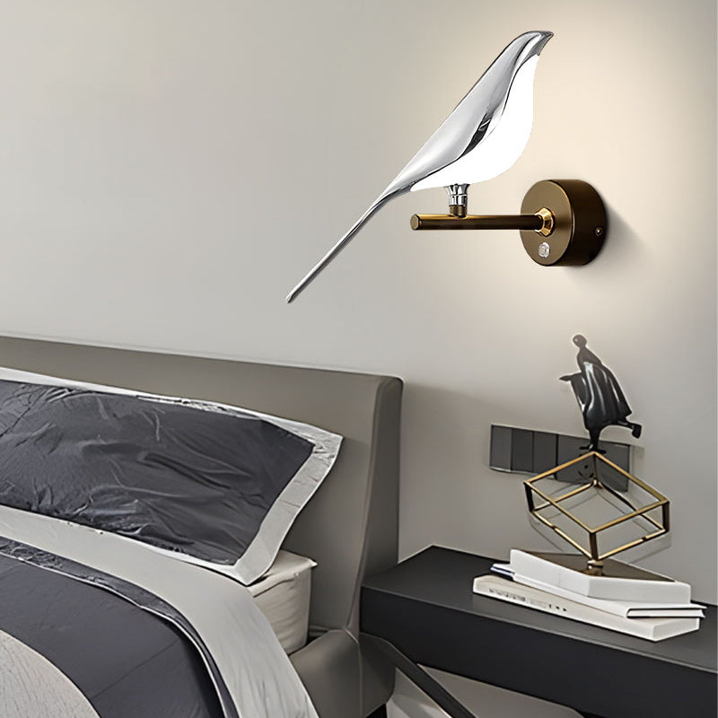 Elegant bird wall light extending over a modern bedside table as an accent piece in the interior design.