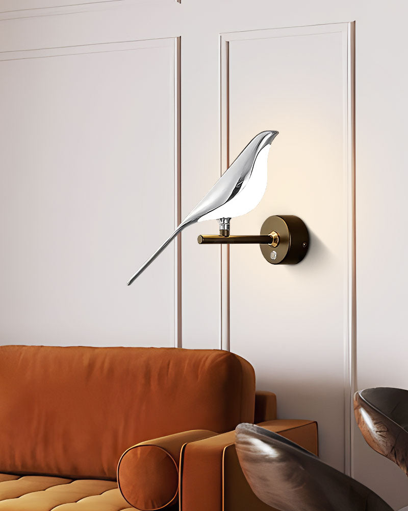 Modern Bird Wall Light as an accent piece above a brown sofa in an interior design setting.