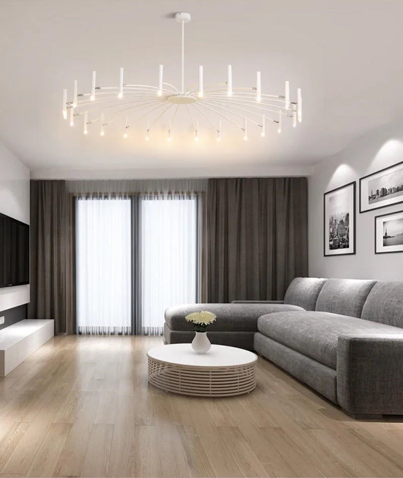 A modern living room with adjustable lighting, white furniture, and wooden floors exudes elegance.