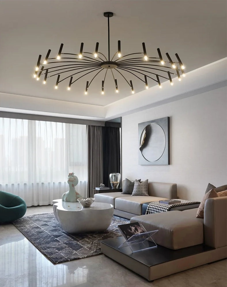 A modern living room with an elegant contemporary candle style chandelier providing adjustable lighting.