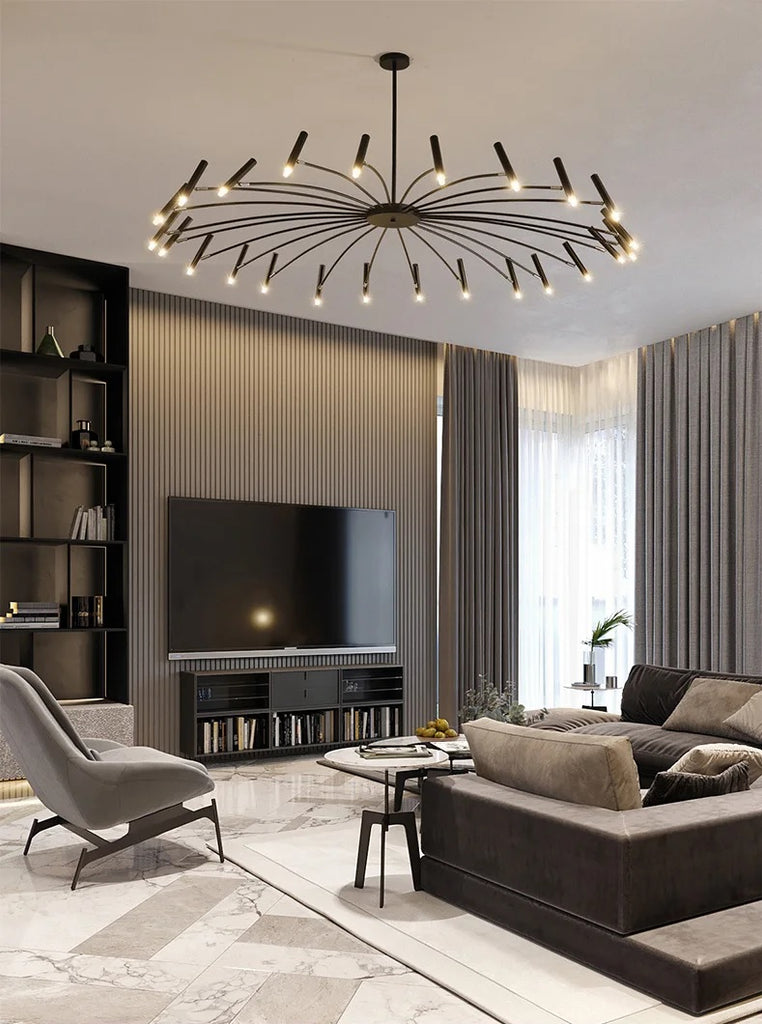 A modern living room with an elegant, candle style chandelier that has adjustable lighting.