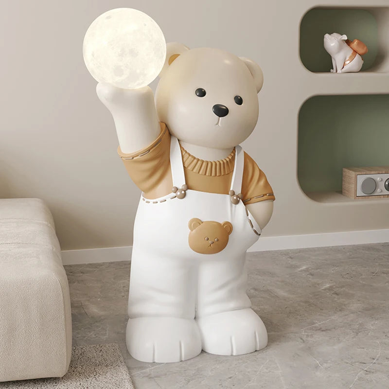 A decorative lamp shaped like a cartoon bear holding a glowing moon, standing in a softly lit room, enhancing the home ambiance.
