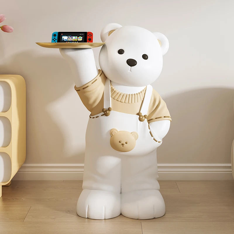 Large white bear art piece holding a Nintendo Switch on a tray in a room with wooden floors and white walls, designed to enhance the home ambiance.