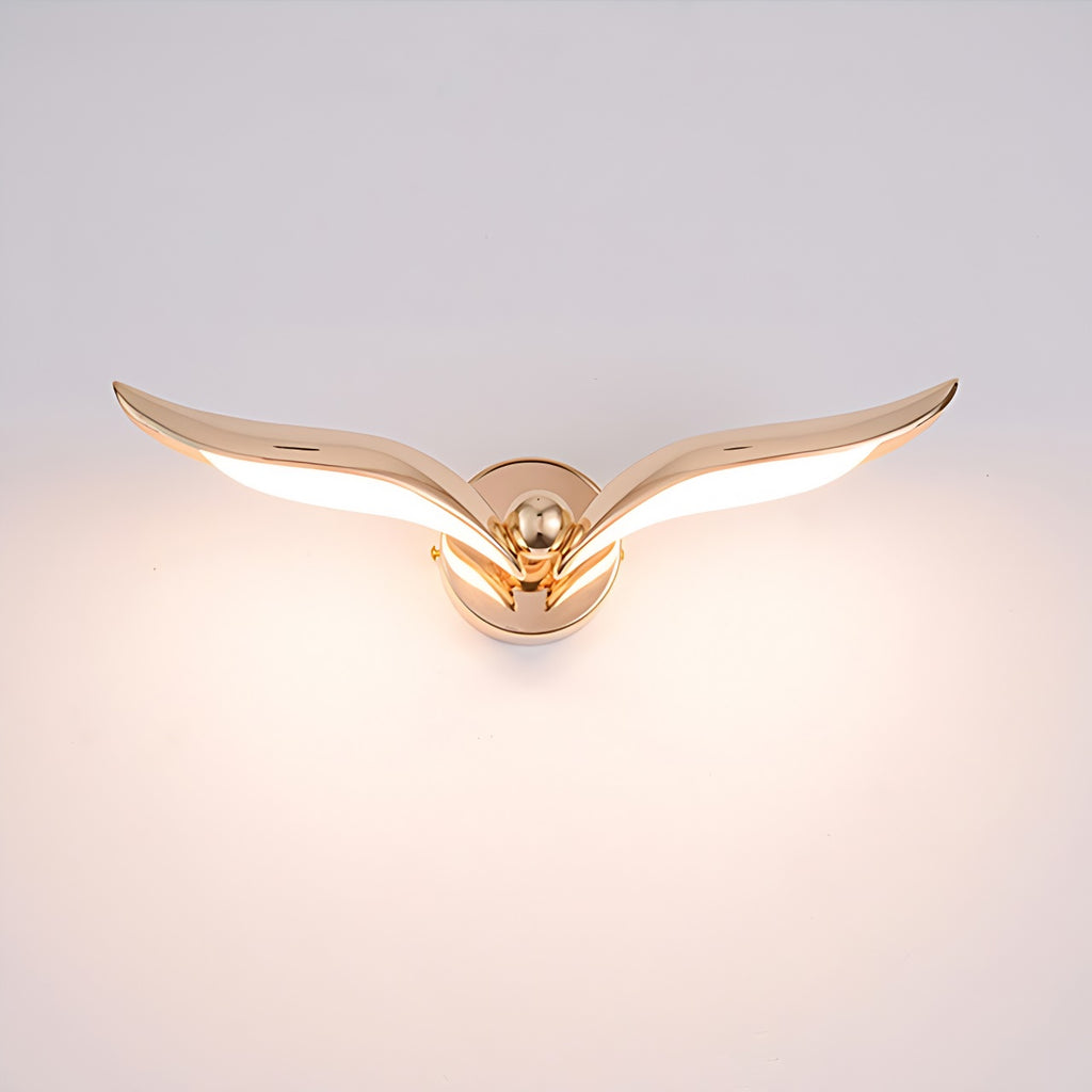 An interior wall light with a gold eagle decoration, adding a touch of decor to any space.