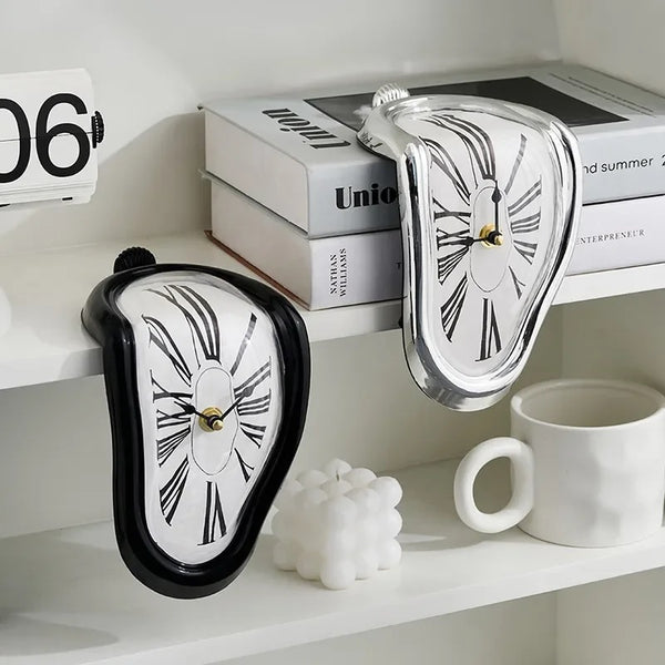 A Salvador Dali-inspired clock sitting on a shelf next to a cup of coffee, adding an artistic flair with its unique and funny twist.