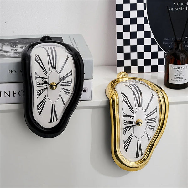 Two Salvador Dali-inspired clocks showcase an artistic flair, creating a unique and funny twist next to a book.