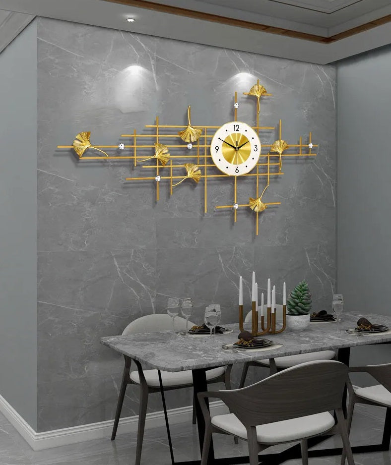 An interior dining room with a Ginkgo Leaf Wall Clock adding an artistic touch to the gold wall.