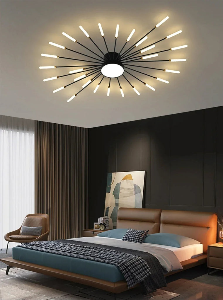 A modern bedroom with a bed and a Magic Wand Ceiling Light.