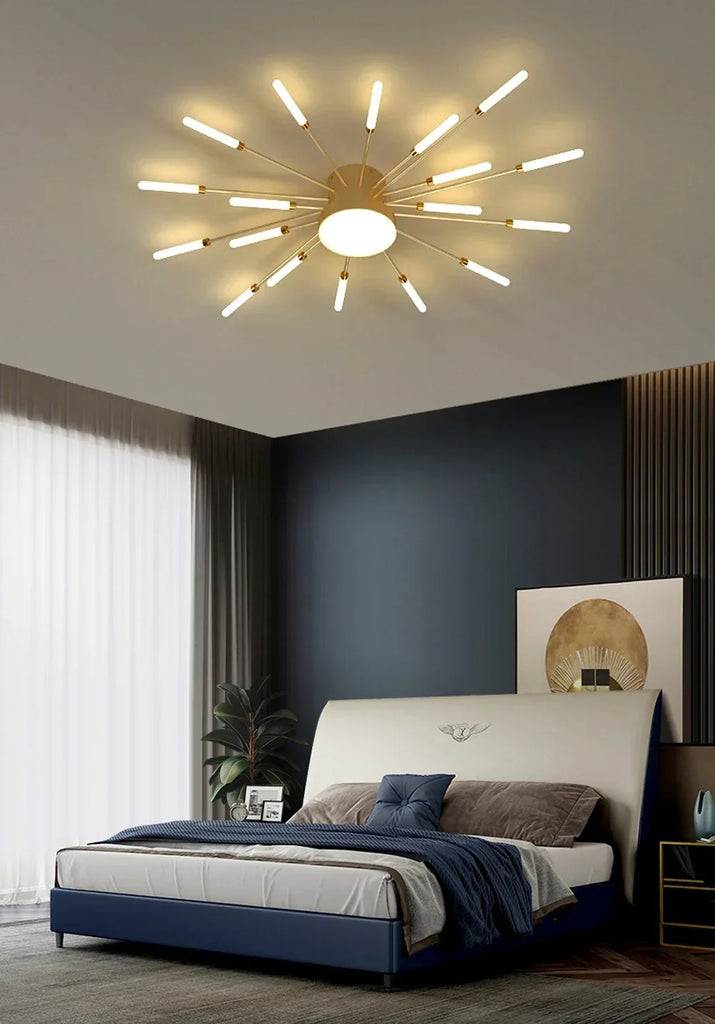 A bedroom with a sunflower design bed and a Magic Wand Ceiling Light with brushed antique gold finish.