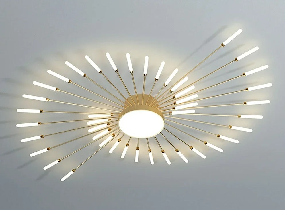 The Magic Wand Ceiling Light features a mesmerizing spiral design, adorned with a brushed antique gold finish. It casts a captivating glow, reminiscent of a blooming sunflower.