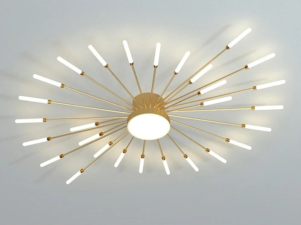 A Magic Wand Ceiling Light featuring a starburst pattern and a brushed antique gold finish.