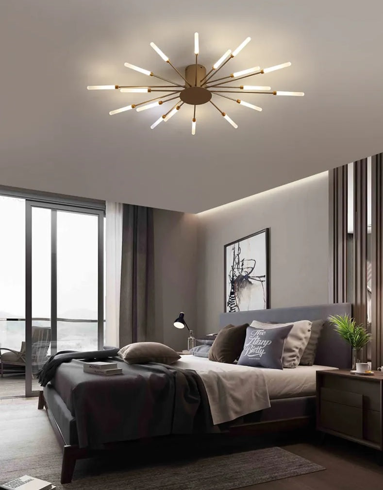 A modern bedroom with a bed and a Magic Wand Ceiling Light.